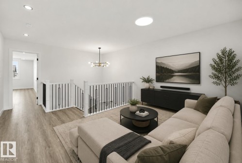 Spacious open loft area with wood-finish flooring - 3 Pierwyck Loop, Spruce Grove, AB - Indoor Photo Showing Living Room