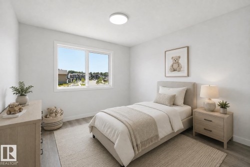 Bright interior room featuring a large window, recessed lighting, and wood-finish flooring - 3 Pierwyck Loop, Spruce Grove, AB - Indoor Photo Showing Bedroom