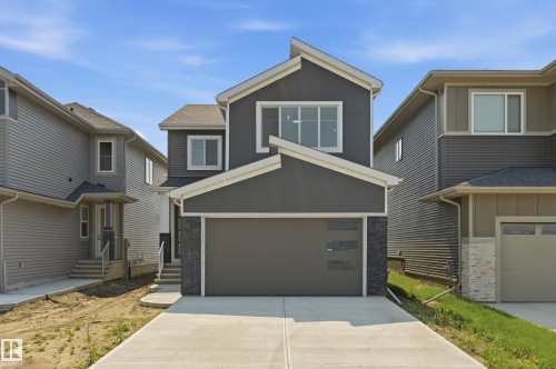Contemporary two-story residence featuring a dark gray facade with white trim - 3 Pierwyck Loop, Spruce Grove, AB - Outdoor With Facade