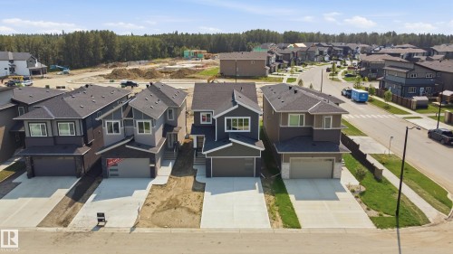 Contemporary residential architecture with prominent gables and dark shingle roofing - 3 Pierwyck Loop, Spruce Grove, AB - Outdoor With Facade