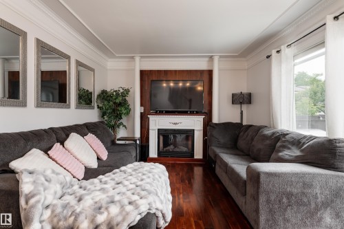 Living room - 747 Clareview Road Nw, Edmonton, AB - Indoor Photo Showing Living Room With Fireplace