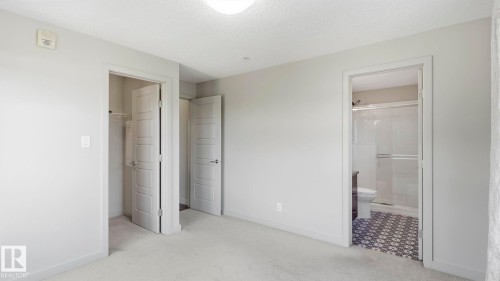 Carpeted interior space with light-toned walls and ceiling - #361 7805 71 St Nw, Edmonton, AB - Indoor Photo Showing Other Room