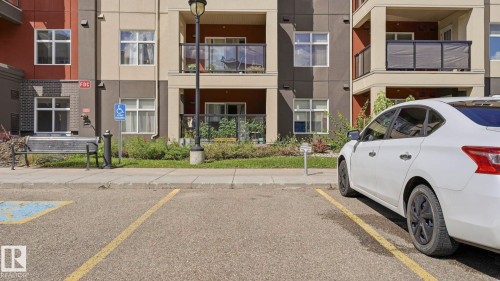 Multi-story building exterior featuring balconies with glass railings - #361 7805 71 St Nw, Edmonton, AB - Outdoor With Balcony