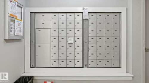 Centralized mailboxes with individual locking compartments - #361 7805 71 St Nw, Edmonton, AB - Indoor Photo Showing Other Room