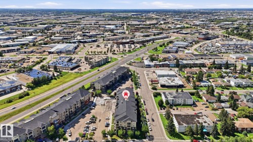 Residential building with dark siding and light trim, situated among other multi-unit structures - #361 7805 71 St Nw, Edmonton, AB - Outdoor With View
