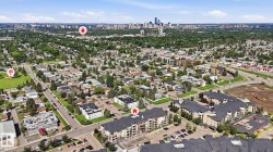 Aerial perspective showcasing a residential area with a prominent city skyline in the distance - 