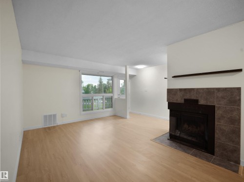 #168 2703 79 St Nw, Edmonton, AB - Indoor Photo Showing Living Room With Fireplace