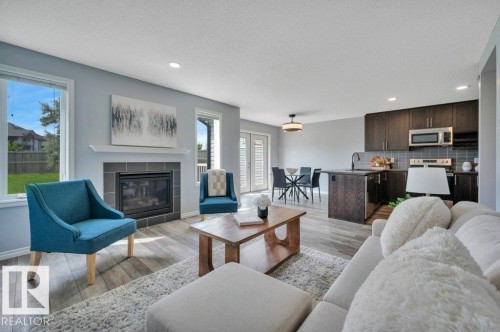 3508 16 Street Nw, Edmonton, AB - Indoor Photo Showing Living Room With Fireplace