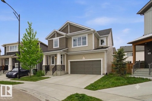 Two-story residence featuring a combination of horizontal siding and shake siding - 1607 202 Street Nw, Edmonton, AB - Outdoor With Facade