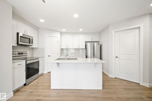 #90 50 Mclaughlin Dr, Spruce Grove, AB - Indoor Photo Showing Kitchen With Stainless Steel Kitchen