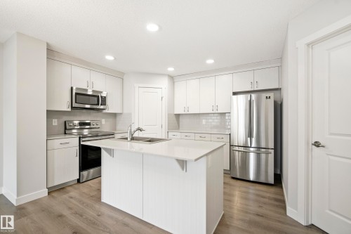 #90 50 Mclaughlin Dr, Spruce Grove, AB - Indoor Photo Showing Kitchen With Stainless Steel Kitchen With Double Sink