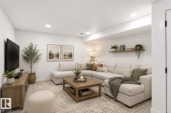 Recreational living space featuring recessed lighting, a floating wooden shelf, a media console, and a neutral-toned area rug - 