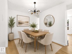 Brightly lit dining space featuring a contemporary chandelier with clear glass globes, light wood-finish flooring, and white wall finishes - 