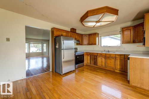 3908 28 Avenue Nw, Edmonton, AB - Indoor Photo Showing Kitchen With Double Sink