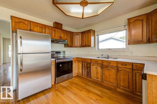 3908 28 Avenue Nw, Edmonton, AB - Indoor Photo Showing Kitchen With Double Sink