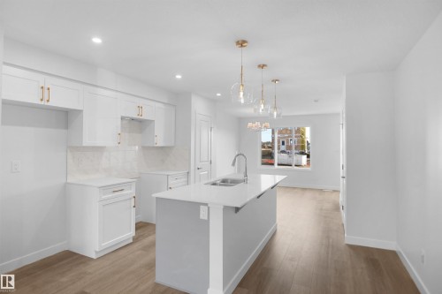 94 Juniper Wynd, Fort Saskatchewan, AB - Indoor Photo Showing Kitchen With Double Sink With Upgraded Kitchen