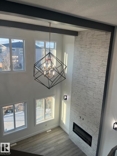 2 Southbridge Court, Calmar, AB - Indoor Photo Showing Other Room With Fireplace