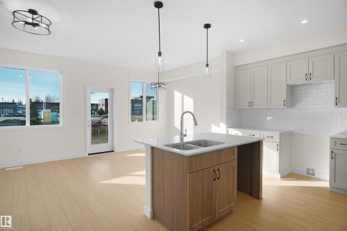 33 Foxtail Road, Fort Saskatchewan, AB - Indoor Photo Showing Kitchen With Double Sink