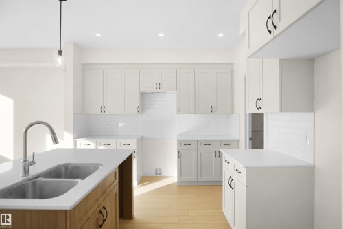 33 Foxtail Road, Fort Saskatchewan, AB - Indoor Photo Showing Kitchen With Double Sink
