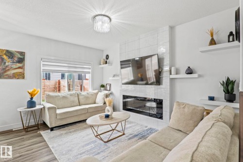 3523 5A Avenue Sw, Edmonton, AB - Indoor Photo Showing Living Room With Fireplace