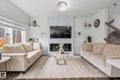 3523 5A Avenue Sw, Edmonton, AB - Indoor Photo Showing Living Room With Fireplace