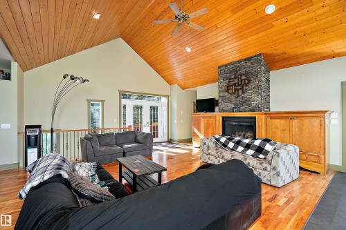 48003 Rr271, Rural Leduc County, AB - Indoor Photo Showing Living Room With Fireplace