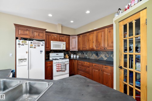 48003 Rr271, Rural Leduc County, AB - Indoor Photo Showing Kitchen With Double Sink