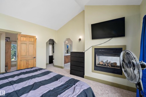 48003 Rr271, Rural Leduc County, AB - Indoor Photo Showing Bedroom With Fireplace