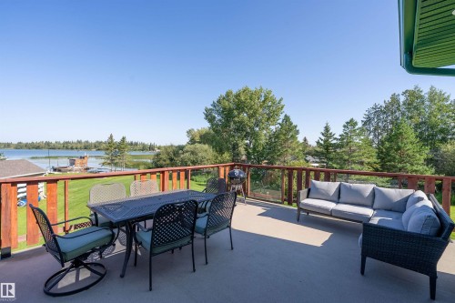48003 Rr271, Rural Leduc County, AB - Outdoor With Body Of Water With Deck Patio Veranda With Exterior