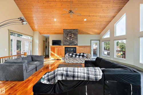 48003 Rr271, Rural Leduc County, AB - Indoor Photo Showing Living Room With Fireplace