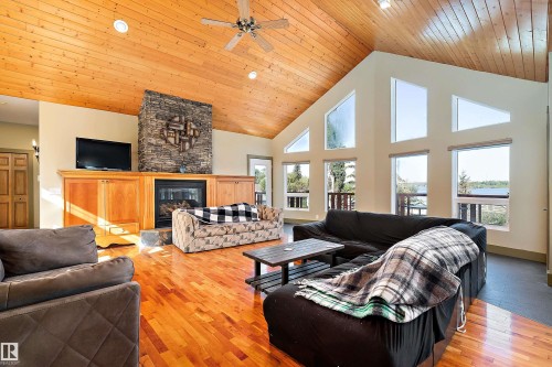 48003 Rr271, Rural Leduc County, AB - Indoor Photo Showing Living Room With Fireplace