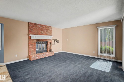 90 Dufferin Street, St. Albert, AB - Indoor Photo Showing Living Room With Fireplace