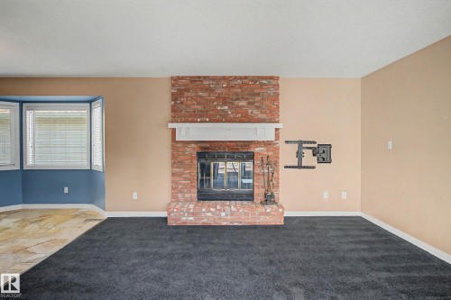 90 Dufferin Street, St. Albert, AB - Indoor Photo Showing Living Room With Fireplace