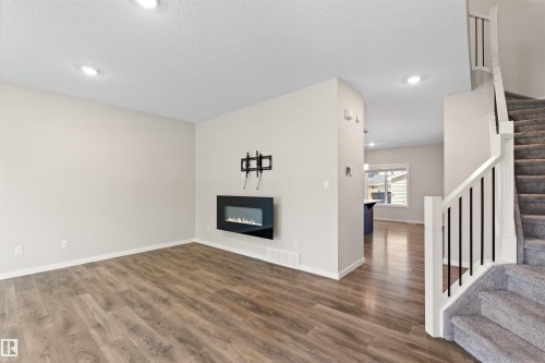 16040 11 Avenue Sw, Edmonton, AB - Indoor Photo Showing Other Room With Fireplace