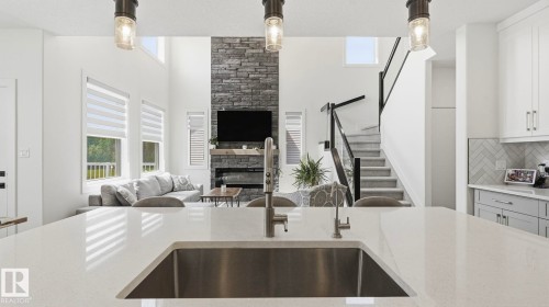 19 Holt Cove, Spruce Grove, AB - Indoor Photo Showing Kitchen With Fireplace