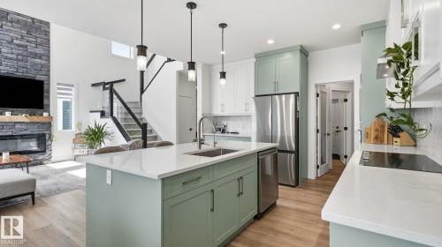 19 Holt Cove, Spruce Grove, AB - Indoor Photo Showing Kitchen With Fireplace With Upgraded Kitchen