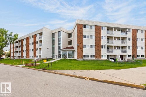 Multi-story residential building featuring a brick and light-colored siding facade - #5 11265 31 Av Nw, Edmonton, AB - Outdoor With Facade
