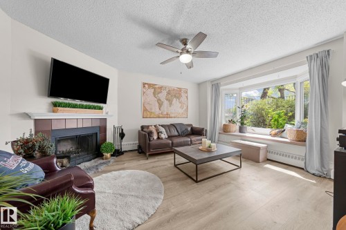 10518 84 Avenue Nw, Edmonton, AB - Indoor Photo Showing Living Room With Fireplace
