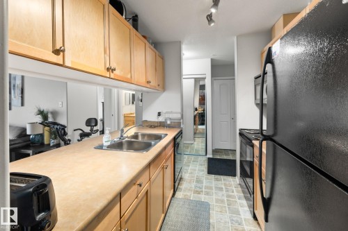#132 50 Woodsmere Close, Fort Saskatchewan, AB - Indoor Photo Showing Kitchen With Double Sink