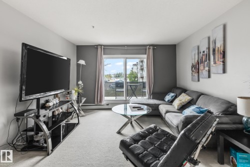 #132 50 Woodsmere Close, Fort Saskatchewan, AB - Indoor Photo Showing Living Room