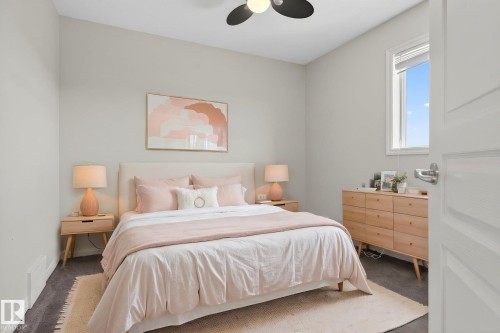 Bedroom featuring a ceiling fan with integrated lighting, a window with blinds, and dark carpet flooring - 96 Dalquist Bay, Leduc, AB - Indoor Photo Showing Bedroom