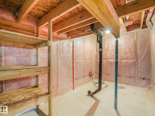 Unfinished lower level featuring exposed wood framing, ceiling joists, and a concrete floor - 11844 21 Avenue Sw, Edmonton, AB - Indoor Photo Showing Basement