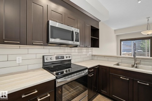 29 Hudson Cove, Spruce Grove, AB - Indoor Photo Showing Kitchen With Double Sink