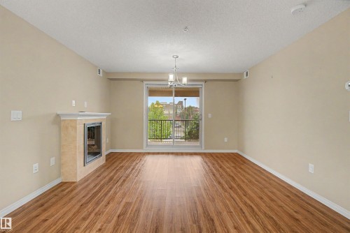 #215 4450 Mccrae Av Nw, Edmonton, AB - Indoor With Fireplace
