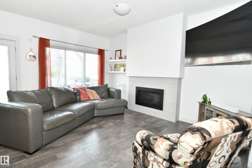 560 Sturtz Link, Leduc, AB - Indoor Photo Showing Living Room With Fireplace