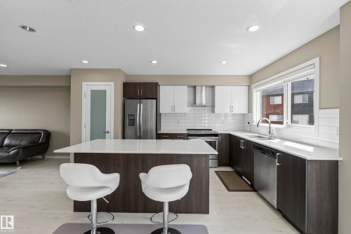 #10 1075 Rosenthal Bv Nw, Edmonton, AB - Indoor Photo Showing Kitchen With Stainless Steel Kitchen With Upgraded Kitchen