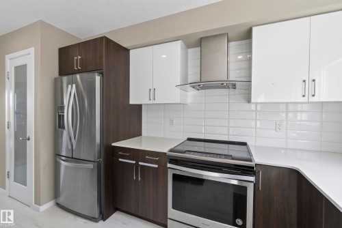 #10 1075 Rosenthal Bv Nw, Edmonton, AB - Indoor Photo Showing Kitchen With Stainless Steel Kitchen