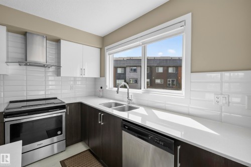 #10 1075 Rosenthal Bv Nw, Edmonton, AB - Indoor Photo Showing Kitchen With Stainless Steel Kitchen With Double Sink With Upgraded Kitchen