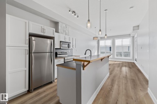 #114 10531 117 St Nw, Edmonton, AB - Indoor Photo Showing Kitchen With Upgraded Kitchen