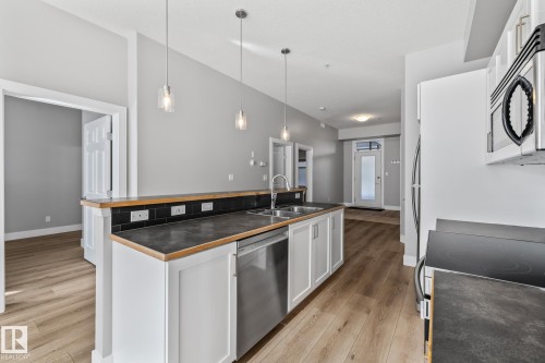 #114 10531 117 St Nw, Edmonton, AB - Indoor Photo Showing Kitchen With Double Sink With Upgraded Kitchen